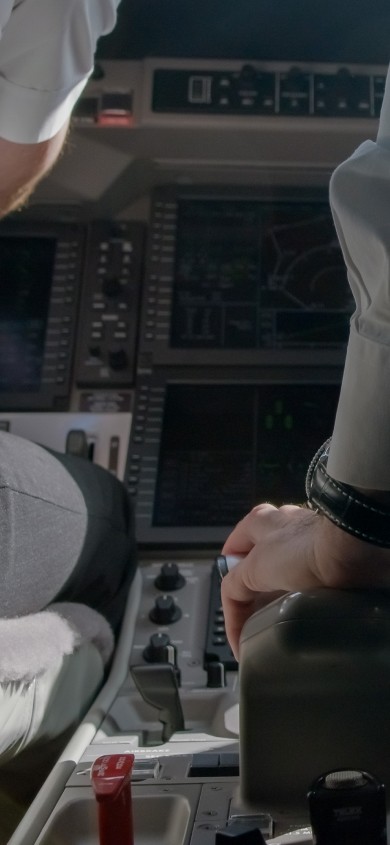 Closeup of pilots flying a Pilatus aircraft