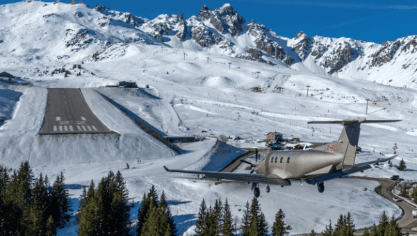 Jetfly Pilatus PC-12 on a runway from top.