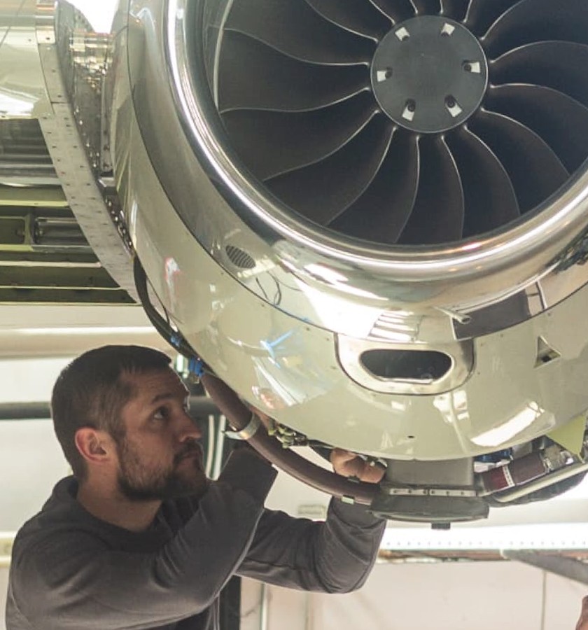 Engineer working on Pilatus PC-24 engine