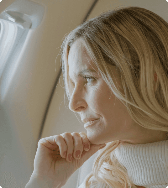 Passenger on the phone onboard a Pilatus aircraft