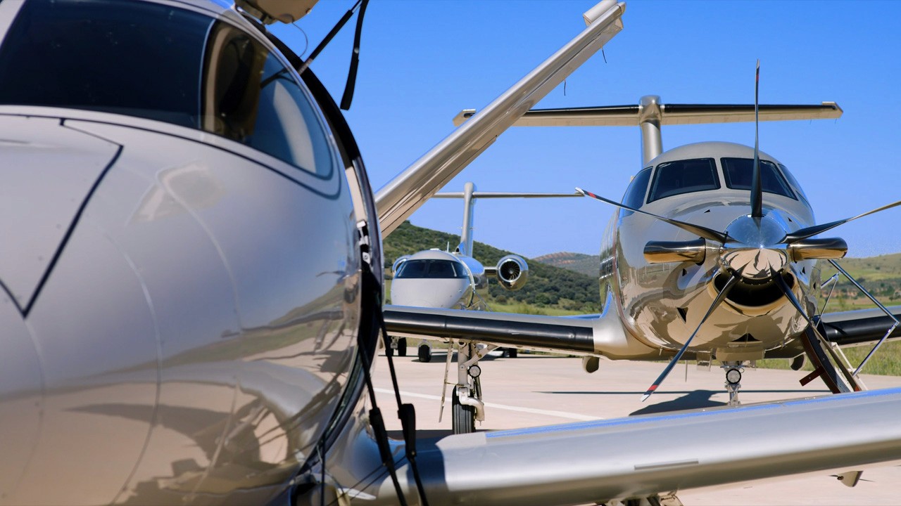 Cirrus Jet, Pilatus PC-12 and PC-24 of Jetfly on a runway